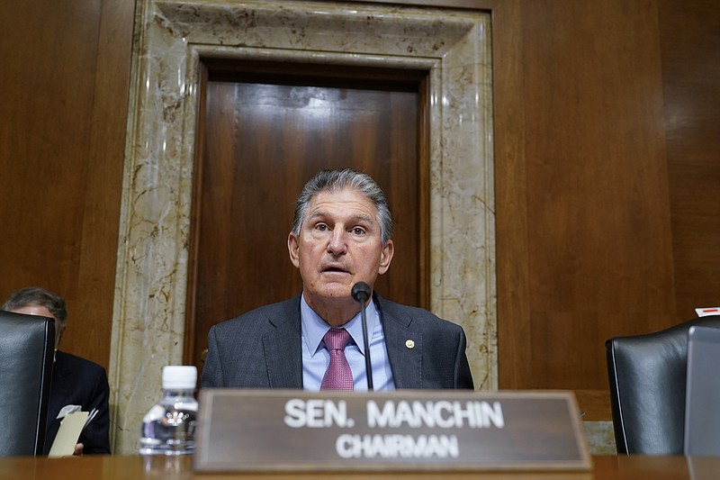 Sen. Joe Manchin, D-W.Va., arrives to chair the Senate Energy and Natural Resources Committee, as congressional Democrats speed ahead this week in pursuit of President Joe Biden's $3.5 trillion plan for social and environmental spending, at the Capitol in Washington, Tuesday, Sept. 21, 2021. Manchin, a Democratic senator vital to the bill's fate, has balked at the price tag. (AP Photo/J. Scott Applewhite)