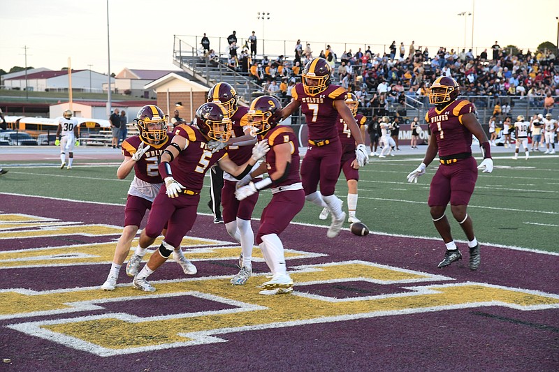 Lake Hamilton's Justin Crutchmer (5) celebrates with his teammates after scoring a touchdown against Hot Springs on Sept. 17. The Wolves host Little Rock Parkview Friday. - Photo by Tanner Newton of The Sentinel-Record