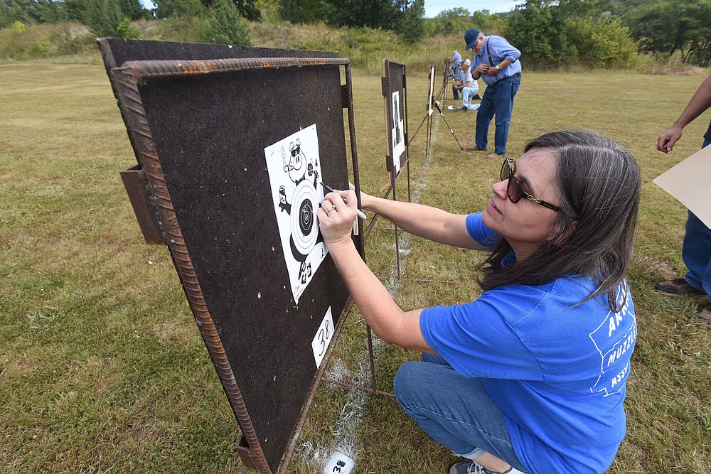 Angie Reynolds of Russellville adds up her score Sept. 24 2021 after shooting her muzzle-loading rifle.
(NWA Democrat-Gazette/Flip Putthoff)