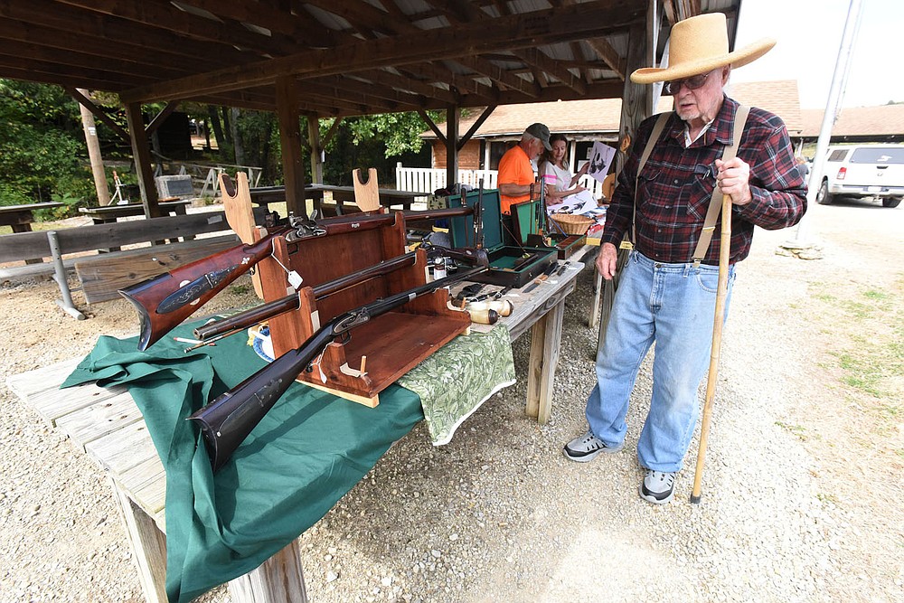Charlie Caywood of War Eagle shows Sept. 24 2021 some of the black powder rifles he's built. Caywood celebrated his 90th birthday with friends at the muzzle-shoot. He's still making guns.
(NWA Democrat-Gazette/Flip Putthoff)