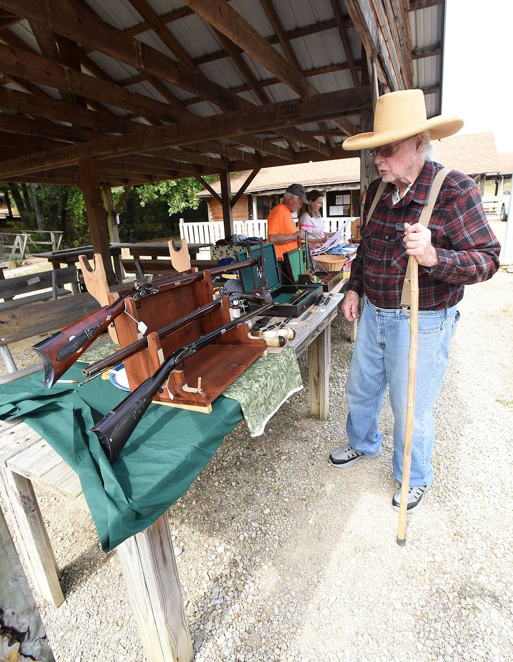 Charlie Caywood of War Eagle shows Sept. 24 2021 some of the black powder rifles he's built. Caywood celebrated his 90th birthday with friends at the muzzle-shoot. He's still making guns.
(NWA Democrat-Gazette/Flip Putthoff)