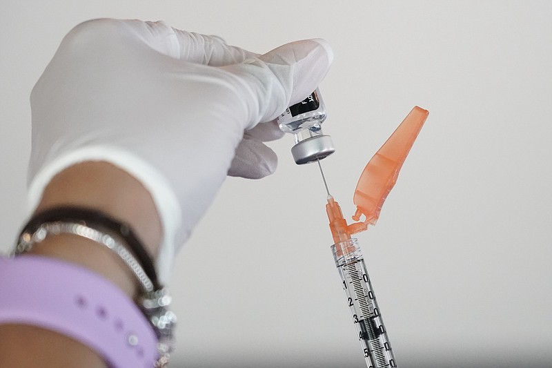 The Associated Press
A nurse loads a syringe with the Pfizer COVID-19 vaccine in Jackson, Miss., on Sept. 21. Millions of Americans are now eligible to receive a Pfizer booster shot to help increase their protection against the worst effects of the coronavirus.