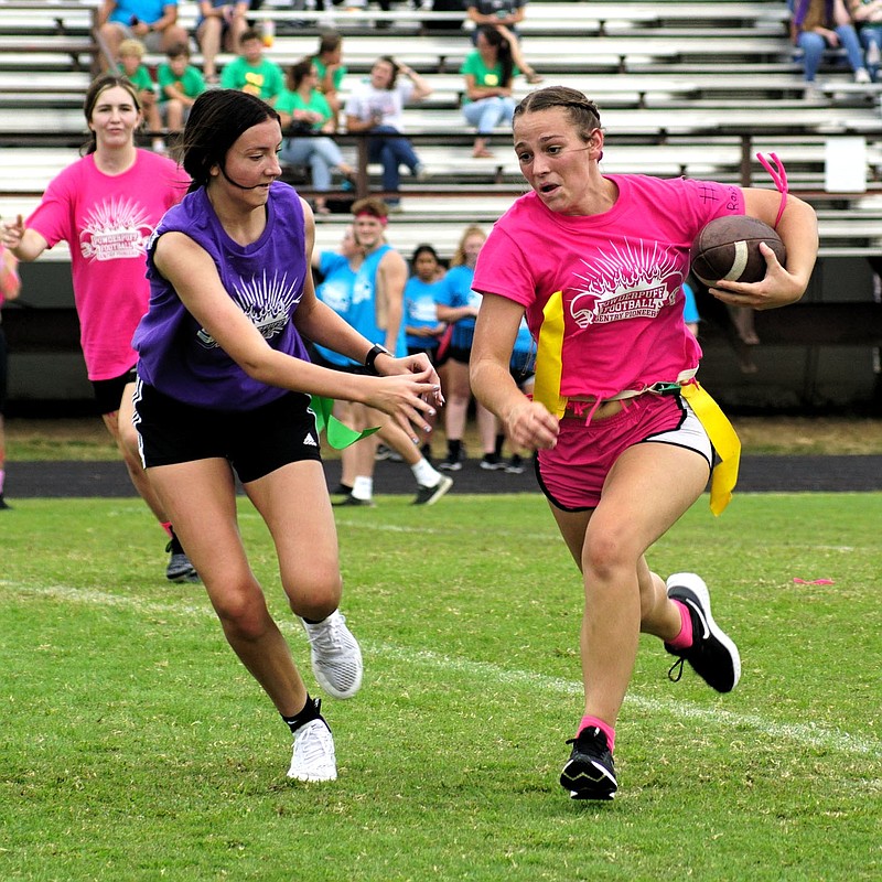 Westside Eagle Observer/RANDY MOLL
Gentry junior Madison Voyles runs the ball while pursued by freshman Alexis Osbourn during play against the freshmen on Sept. 29 at Gentry High School.