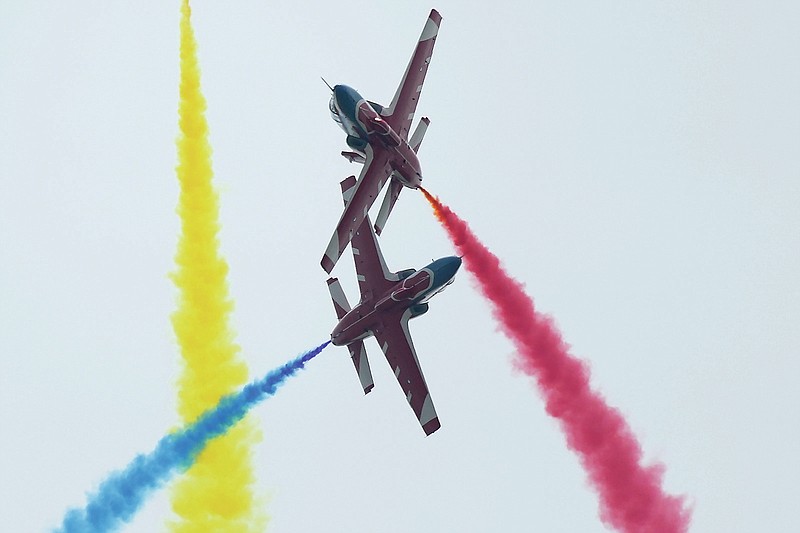 Members of the Chinese People's Liberation Army (PLA) Air Force Aviation University's &quot;Red Falcon&quot; Air Demonstration Team perform during the 13th China International Aviation and Aerospace Exhibition, also known as Airshow China 2021, on Tuesday, Sept. 28, 2021, in Zhuhai in southern China's Guangdong province. (AP Photo/Ng Han Guan)