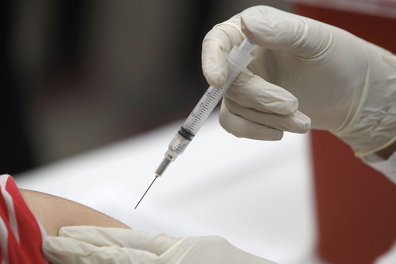 In this Jan. 23, 2020, file photo, a patient receives an influenza vaccine in Mesquite, Texas. - Photo by The Associated Press