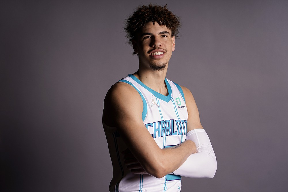 FILE - Charlotte Hornets' LaMelo Ball poses for a picture during the NBA basketball team's media day Monday, Sept. 27, 2021, in Charlotte, N.C. LaMelo Ball made the transition from playing basketball overseas to the NBA last season look fairly easy, breezing his way to Rookie of the Year honors. Now Hornets coach James Borrego wants his point guard to take the next step.(AP Photo/Chris Carlson, File)