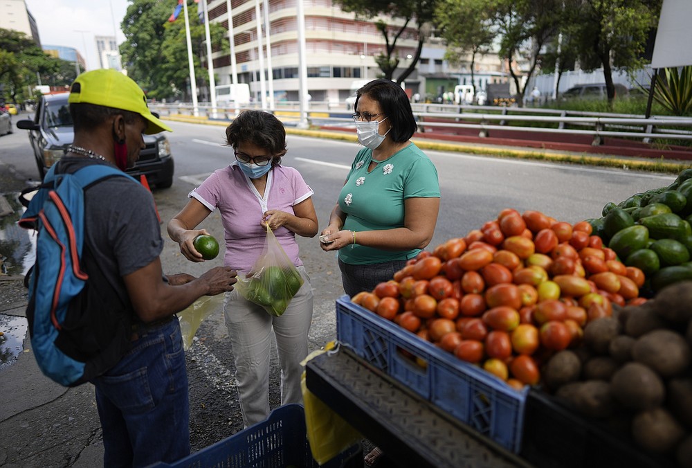 Venezuela Rolls Out New Currency But Dollar Still Popular   199542369 199541306 Ce41c6d1d56e4c91979d58d3444b517e T1000 