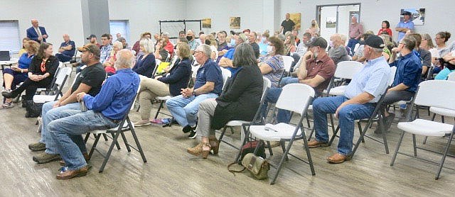 Westside Observer/SUSAN HOLLAND
A crowd of an estimated 125 citizens participates in a question and answer session following a presentation by Lori Tudor, director of the Arkansas Department of Transportation. Tudor was guest speaker at the regular meeting of the Gravette Kiwanis Club and many area residents came out to comment on how proposed highway routes would affect their property and their lives.