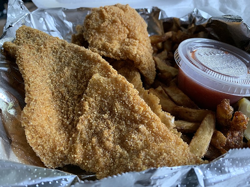 We paid an extra $2 to get our catfish plate with fries at the White Water Tavern. (Arkansas Democrat-Gazette/Eric E. Harrison)