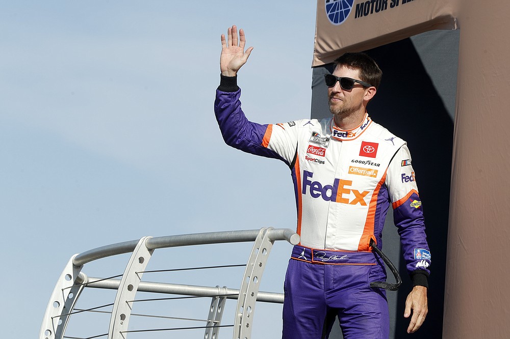NASCAR Cup Series driver Denny Hamlin (11) waves during driver introductions before a NASCAR Cup Series auto race at the Las Vegas Motor Speedway Sunday, Sept. 26, 2021, in Las Vegas. Hamlin won the race. (AP Photo/Steve Marcus)