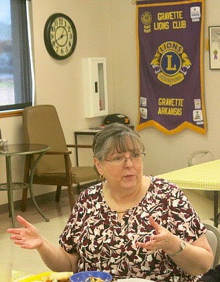 Westside Eagle Observer/SUSAN HOLLAND
Karen Benson, director of the Gravette Public Library, speaks to members of the Gravette Lions Club at their regular meeting Tuesday, Sept. 21. Benson shared details about the Laubach Way to Reading program which will instruct club members how to offer adult literacy training.