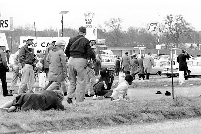 FILE - In this March 7, 1965, file photo, civil rights demonstrators struggle on the ground as state troopers break up a march in Selma, Ala. The world knows the names of John Lewis and a few more of the voting rights demonstrators who walked across Selma's Edmund Pettus Bridge in 1965 only to be attacked by Alabama state troopers on a day that came to be called &#x201c;Bloody Sunday.&#x201d; A new project aims to identify more of the hundreds of people who were involved in the protest. (AP Photo/File)