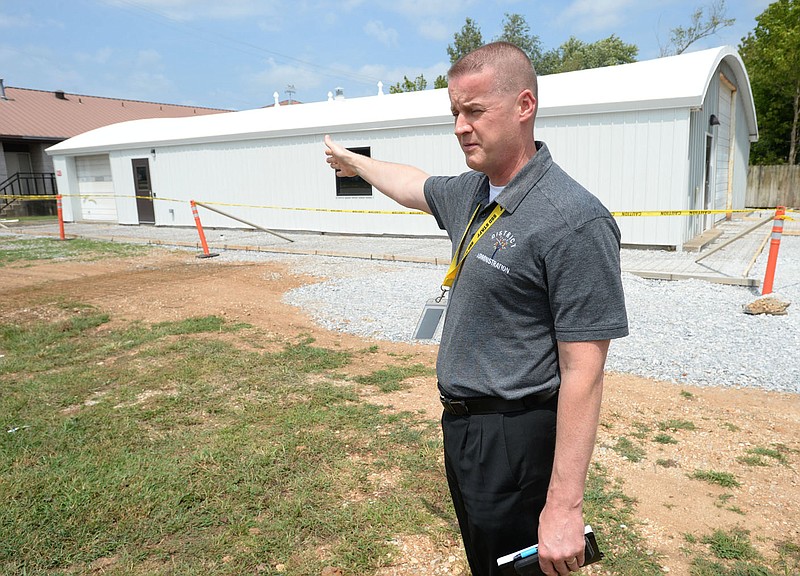 Damon Donnell, student support services coordinator for Springdale Public Schools, speaks Friday, Aug. 20, 2021, during a tour of the planned Springdale Public Schools Treehouse Pantry on Allen Avenue in Springdale. The facility is intended to provide food and necessary items as well as support for families in the district. Visit nwaonline.com/210821Daily/ for today's photo gallery.
(NWA Democrat-Gazette/Andy Shupe)