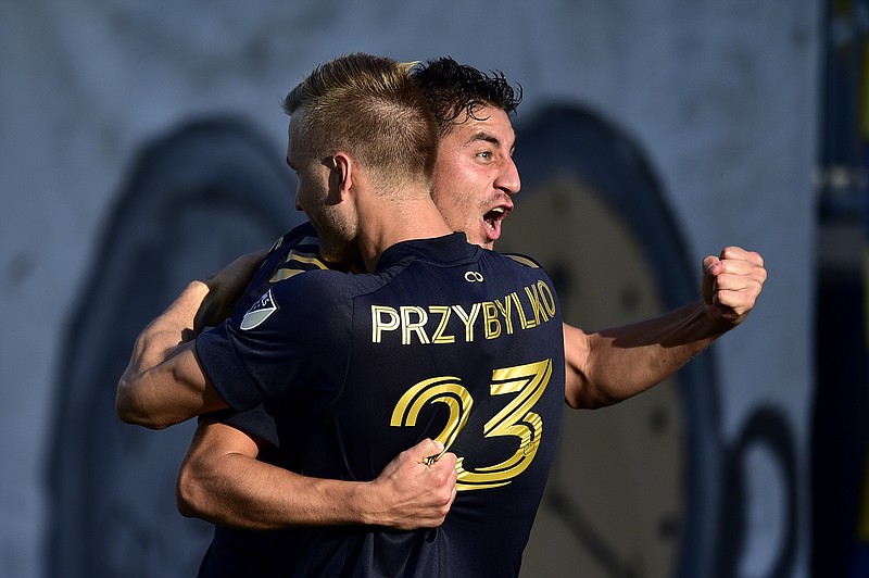 Philadelphia Union's Alejandro Bedoya celebrates with Kacper Przybylko after a goal during the second half of an MLS match against the Columbus Crew Sunday in Chester, Pa. - Photo by Derik Hamilton of The Associated Press