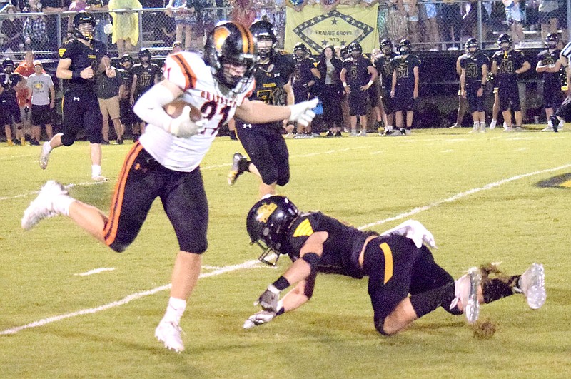 Westside Eagle Observer/MIKE ECKELS
Karl Bontrager (Gravette 21) eludes a tackle on his way to the end zone during the Oct. 1 Prairie Grove-Gravette conference football contest at Tiger Stadium in Prairie Grove. The Lions traveled to Huntsville Friday night where the Eagles took the win 41-19 over the Lions.