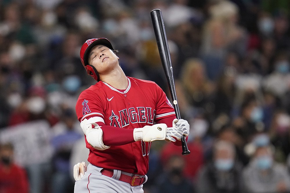 Los Angeles Angels' Shohei Ohtani reacts after hitting sticks to end the seventh inning of a baseball game against the Seattle Mariners on Sunday, October 3, 2021, in Seattle. (AP Photo / Elaine Thompson)