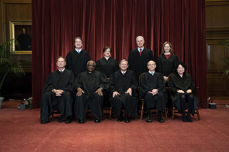FILE - In this April 23, 2021, file photo members of the Supreme Court pose for a group photo at the Supreme Court in Washington. Seated from left are Associate Justice Samuel Alito, Associate Justice Clarence Thomas, Chief Justice John Roberts, Associate Justice Stephen Breyer and Associate Justice Sonia Sotomayor, Standing from left are Associate Justice Brett Kavanaugh, Associate Justice Elena Kagan, Associate Justice Neil Gorsuch and Associate Justice Amy Coney Barrett. (Erin Schaff/The New York Times via AP, Pool, File)