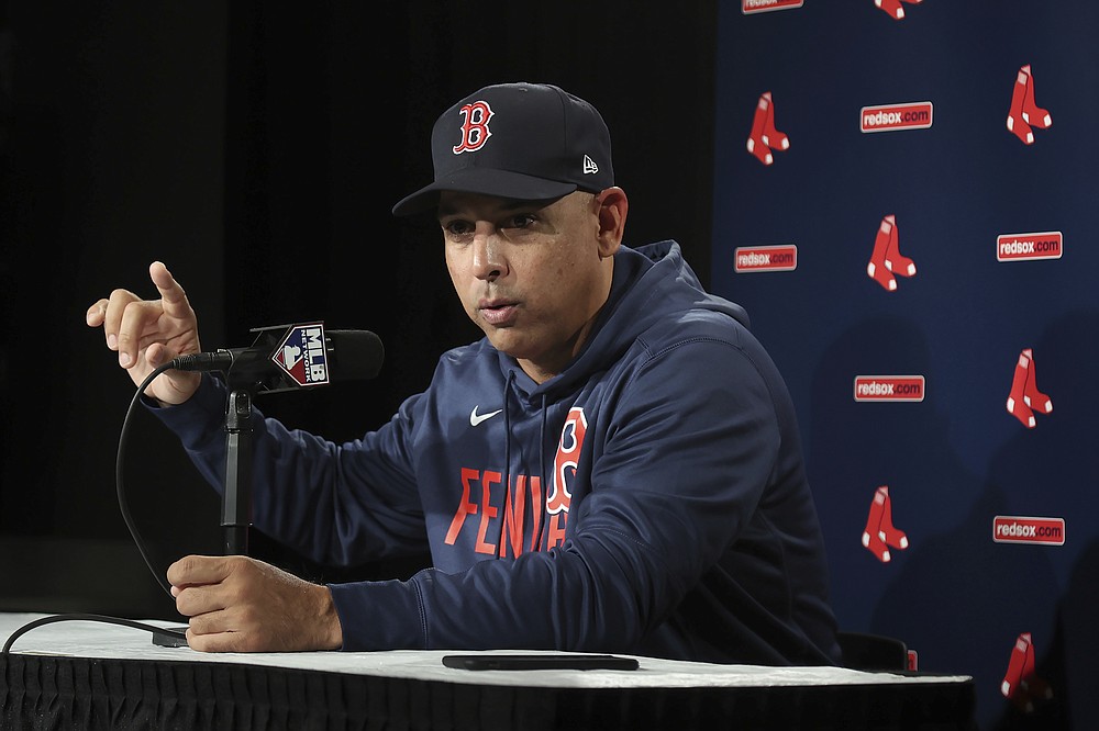 Boston Red Sox manager Alex Cora gestures during a news conference at the American League Wild Card Workout Day at Fenway Park, Monday, Oct. 4, 2021, before Tuesday's American League Wild Card game against the New York Yankees in Boston. (AP Photo/Mary Schwalm)
