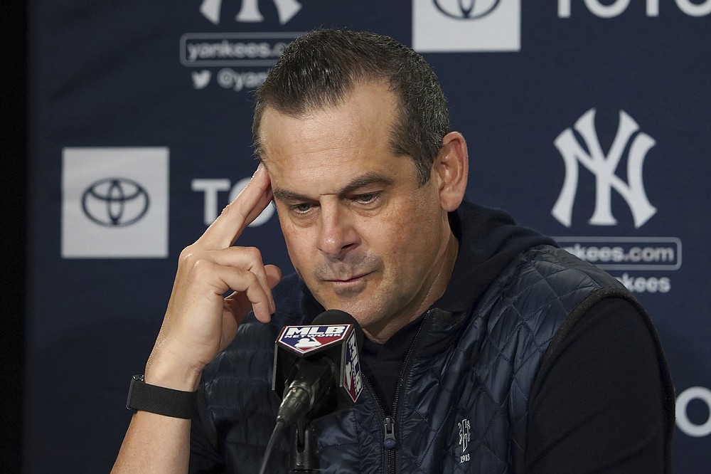 New York Yankees manager Aaron Boone pauses before answering a question during a news conference at the American League Wild Card Workout Day at Fenway Park, Monday, Oct. 4, 2021, before Tuesday's American League Wild Card game against the Boston Red Sox in Boston. (AP Photo/Mary Schwalm)