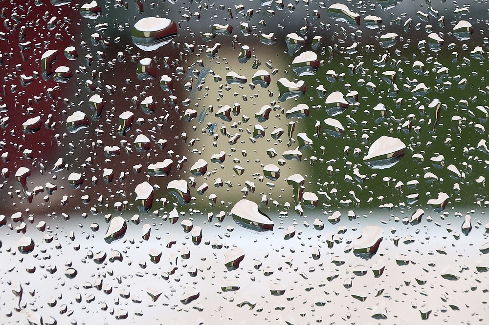 Raindrops cover the press box windows during the American League Wild Card Workout Day at Fenway Park, Monday, Oct. 4, 2021, before Tuesday's American League Wild Card game between the New York Yankees and the Boston Red Sox in Boston. (AP Photo/Mary Schwalm)