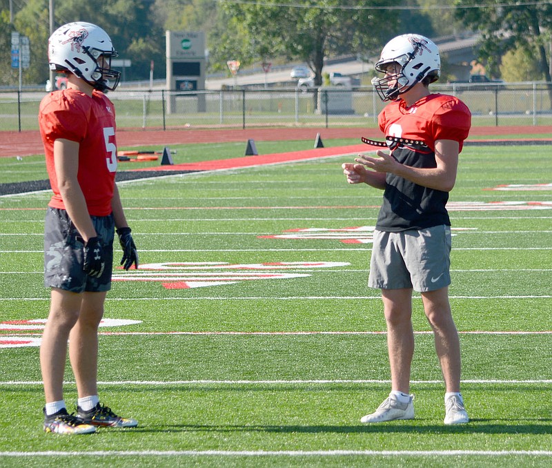 Al Gaspeny/Special to McDonald County Press
Receivers Colton Ruddick (left) and Pierce Harmon talk at practice Monday. Ruddick had six receptions for 143 yards and three touchdowns against East Newton. Harmon added three catches for 36 yards in the 35-13 win.