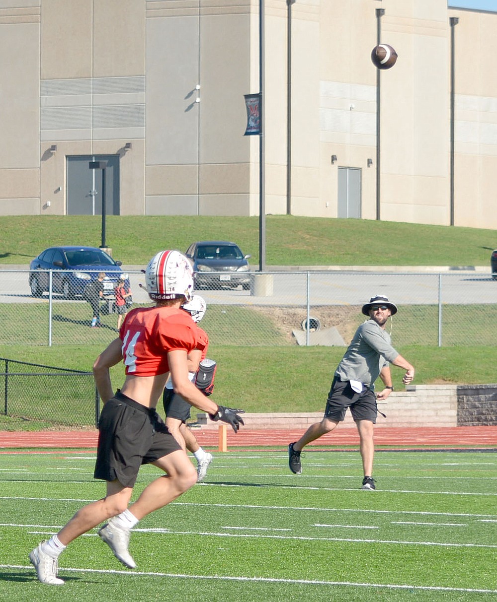 Al Gaspeny/Special to McDonald County Press
Receiver Jack Parnell prepares to make a catch during practice Monday at Mustang Stadium. McDonald County&#x201a;&#xc4;&#xf4;s passing game continues to reach new heights.