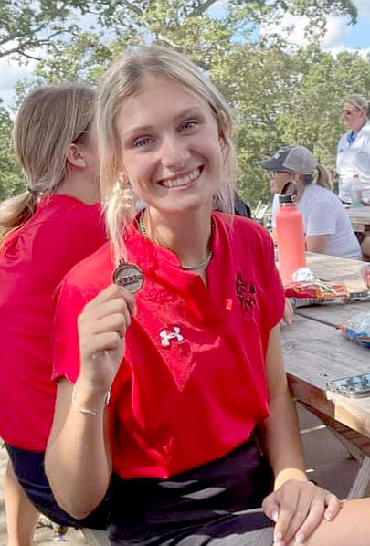 Photo submitted
McDonald County's Kyla Moore holds her medal after finishing eighth in the conference tournament Tuesday.