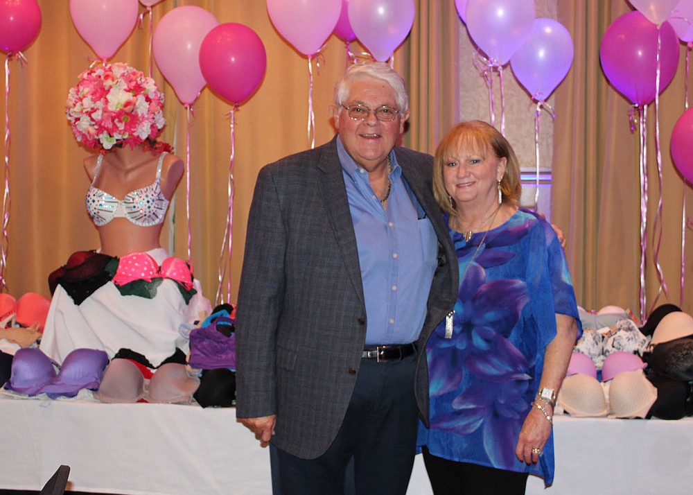 Johnny Bakker and Susan Chase welcome supporters to Help the Girls on Sept. 30 at the Springdale Country Club.
(NWA Democrat-Gazette/Carin Schoppmeyer)