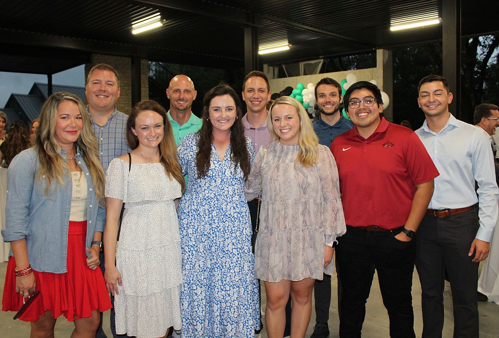 Meredyth and Matthew Malone (from left), Ashley Garske, Mike Klaas, Emily and Jacob Pfeifer, Kirsten James, Caleb Gray, Johnathan Rojo and Adam Corrall gather at the Big Event.
(NWA Democrat-Gazette/Carin Schoppmeyer)