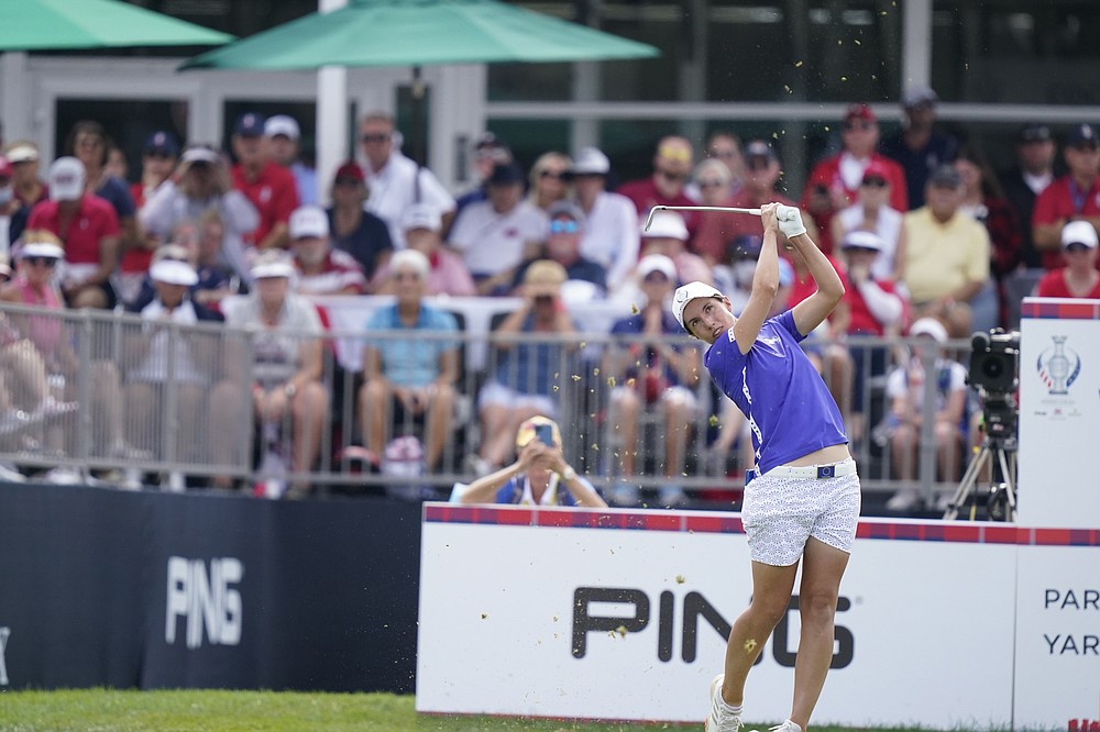 FILE - Europe's Carlota Ciganda drives off the 12th tee during a four-ball match for the Solheim Cup golf tournament in Toledo, Ohio, in this Saturday, Sept. 4, 2021, file photo. Ciganda was the first winner of the Aon Risk-Reward Challenge, which offered equal bonus money of $1 million to men and women. (AP Photo/Carlos Osorio, File)