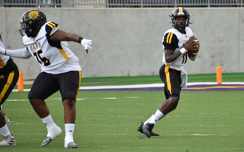 UAPB quarterback Skyler Perry drops back for a pass as offensive lineman Stacey Williams blocks for him during a Sept. 30 loss at Prairie View A&M in Prairie View, Texas. (Pine Bluff Commercial/I.C. Murrell)