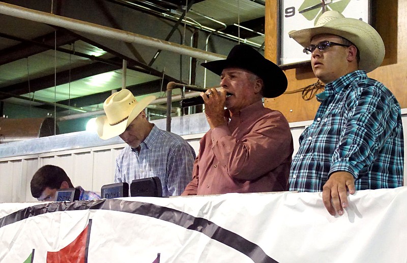 Eldon Cripps, Dwayne Craig and Dillon Butler served as auctioneers at the junior livestock premium auction accepted bids in person and online.
