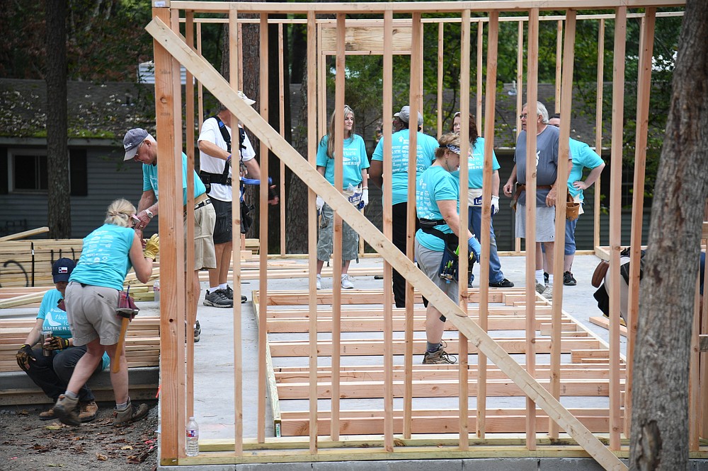 Habitat for Humanity’s sixth annual Heels to Hammers women’s build was underway Wednesday on Terryland Circle, where volunteers are building two houses in 2022. - Photo by Tanner Newton of The Sentinel-Record