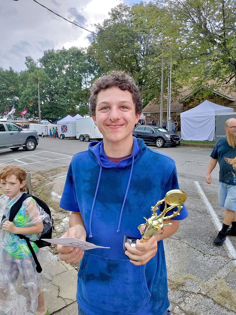 COURTESY PHOTO
Conner LaRue won the Arkansas Apple Festival's first pie eating contest, held Saturday, Oct. 2, on Lincoln Square. He won $50 and a trophy.