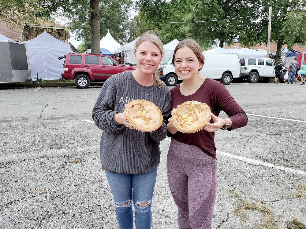 COURTESY PHOTO
Best friends Bailey Fargo and Danielle O'Shields participated in the Arkansas Apple Festival's first pie eating contest, held Saturday, Oct. 2, on Lincoln Square. The young ladies are showing what's left over of their apple pies.