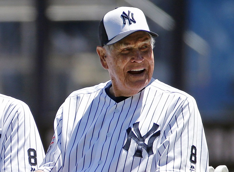 In this June 12, 2016, file photo, former New York Yankees player Eddie Robinson smiles before the Yankees annual Old Timers Day baseball game, in New York. Former big leaguer and general manager Eddie Robinson, who was the oldest living former MLB player, has died at age 100. The Texas Rangers, the team for which Robinson was GM from 1976-82, said he passed away Monday night, Oct. 4, 2021 at his ranch in Bastrop, Texas.(AP Photo/Kathy Willens, File)