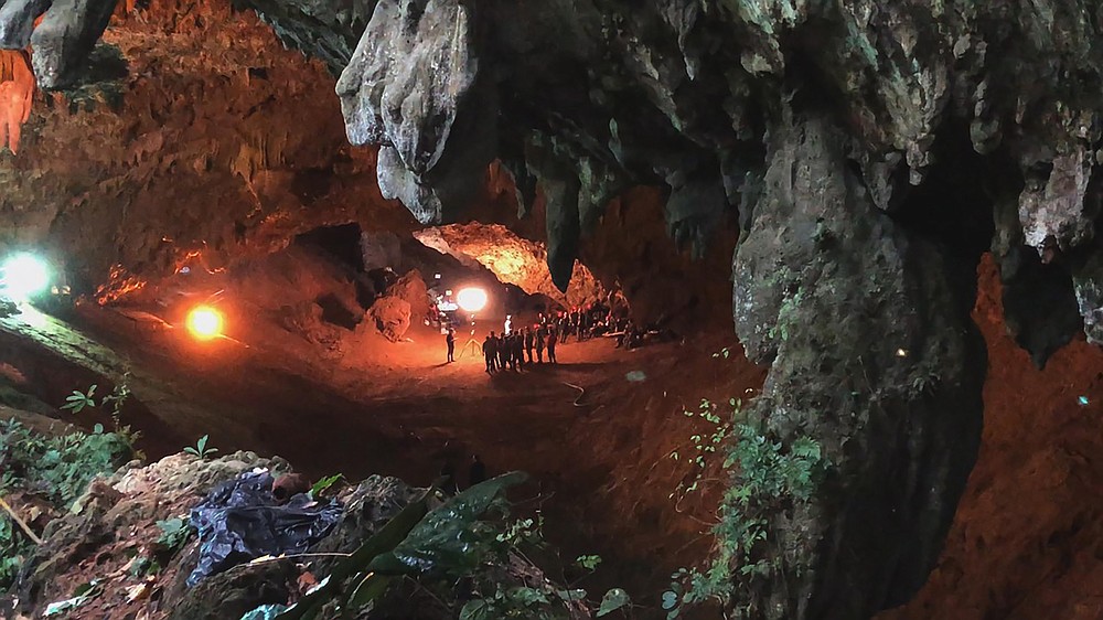 This image released by National Geographic shows a scene from the documentary film "The Rescue," chronicling the 2018 rescue of 12 Thai boys and their soccer coach, trapped deep inside a flooded cave. (National Geographic via AP)