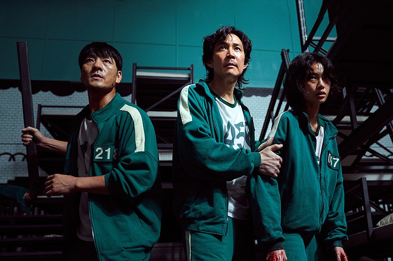 Park Hae-soo (left) as Cho Sang-Woo, Lee Jung-jae as Seong Gi-hun and Jung Hoyeon as Kang Sae-byeok star in the latest Netflix obsession, “Squid Game.” (Netflix/Youngkyu Park)