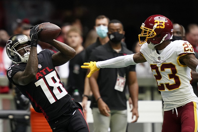 Atlanta Falcons wide receiver Calvin Ridley (18) misses the catch against Washington Football Team cornerback William Jackson (23) during the first half of an NFL football game, Sunday, Oct. 3, 2021, in Atlanta. (AP Photo/Brynn Anderson)