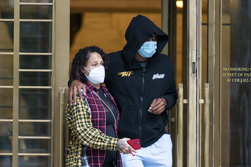 Former NBA basketball player Sebastian Telfair, right, departs Manhattan Federal Court, Thursday, Oct. 7, 2021, in New York. Federal authorities say 18 former NBA players, including Telfair, have been charged with allegedly pocketing $2.5 million illegally by defrauding the league's health and welfare benefit plan. (AP Photo/Eduardo Munoz Alvarez)