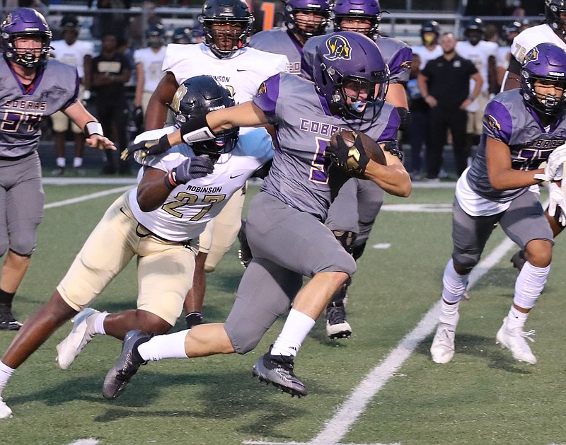 Fountain Lake's Caleb Lacy (5) runs for gain against Joe T. Robinson during a Sept. 24 game at Fountain Lake. Head coach Kenny Shelton said that he found out Thursday that Lacy is out for the remainder of the season. - Photo by Richard Rasmussen of The Sentinel-Record