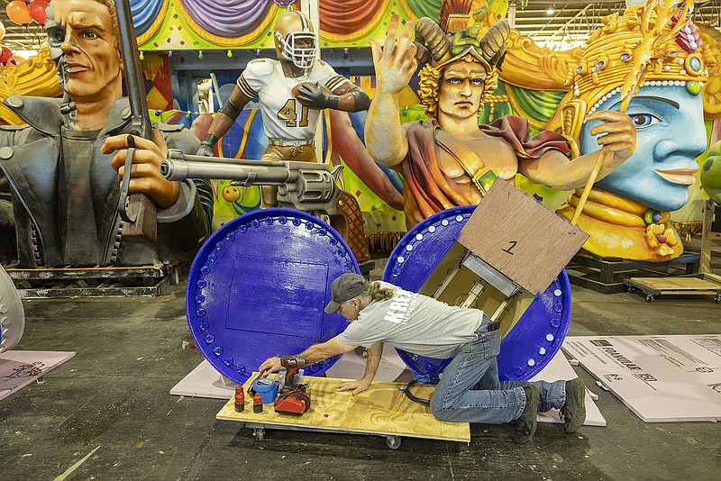 Kenny Bower, a lighting technician with Kern Studios, works Thursday on the early stages of a float at Blaine Kern’s Mardi Gras World in New Orleans. City officials are discussing whether the Mardi Gras celebration will return next year after events were canceled this year because of the pandemic, but no decision has been made.
(AP/The Times-Picayune/The New Orleans Advocate/Chris Granger)