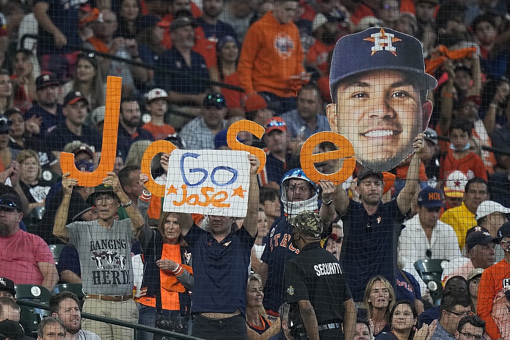 Spectators cheer for Houston Astros second baseman Jose Altuve during the first inning in Game 1 of a baseball American League Division Series between the Houston Astros and the Chicago White Sox Thursday, Oct. 7, 2021, in Houston. (AP Photo/David J. Phillip)