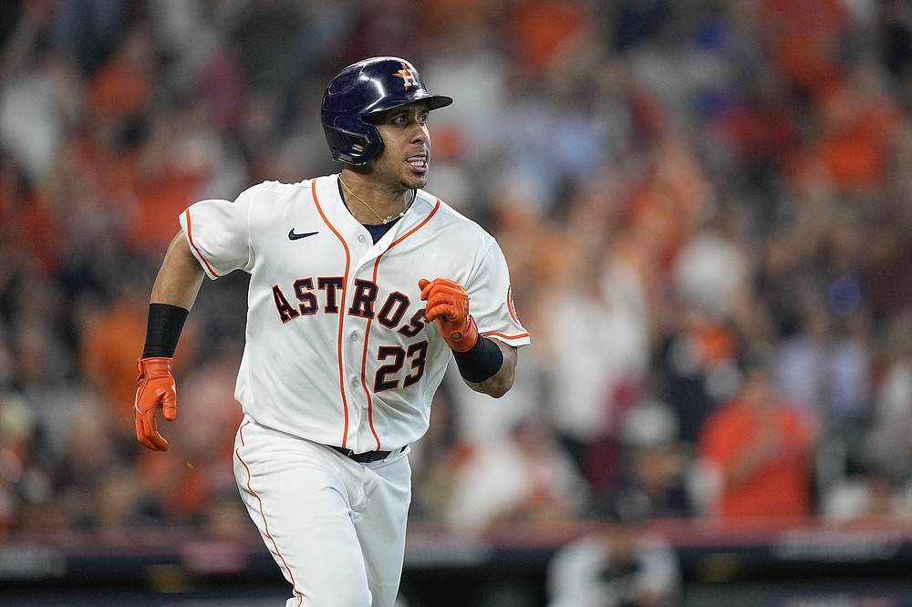 Houston Astros' Michael Brantley watches his two-run single during the fourth inning in Game 1 of a baseball American League Division Series against the Chicago White Sox Thursday, Oct. 7, 2021, in Houston. (AP Photo/David J. Phillip)