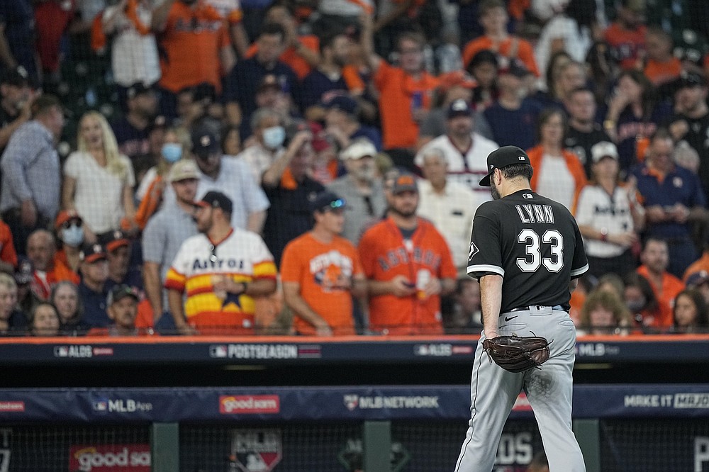 Chicago White Sox starting pitcher Lance Lynn heads to the dugout after being pulled from the game during the fourth inning in Game 1 of a baseball American League Division Series against the Houston Astros Thursday, Oct. 7, 2021, in Houston. (AP Photo/David J. Phillip)