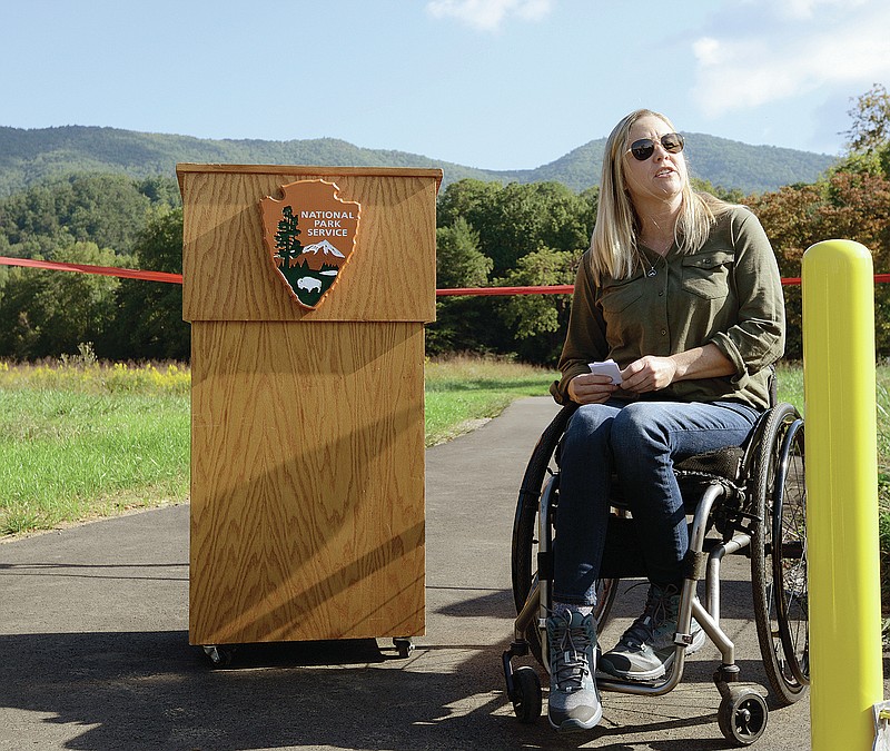 Carly Pearson shares her thoughts at the opening of the new paved trail to the John Oliver cabin in Cades Cove, Tuesday, Sept. 28, 2021 in Great Smoky Mountains National Park near Townsend, Tenn. (Scott Keller/The Daily Times via AP)