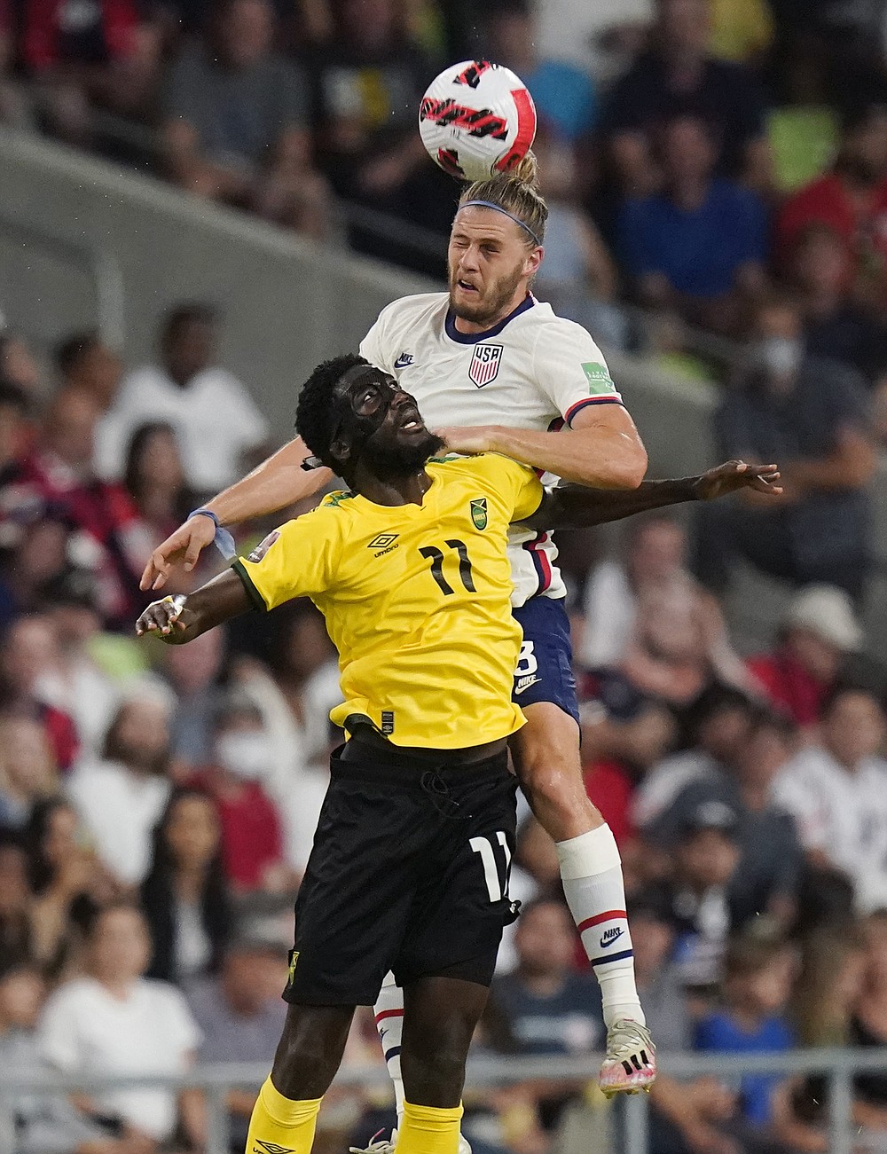 United States' Walker Zimmerman leaps above Jamaica's Shamar Nicholson (11) to head the ball during a FIFA World Cup qualifying soccer match Thursday, Oct. 7, 2021, in Austin, Texas. (AP Photo/Eric Gay)