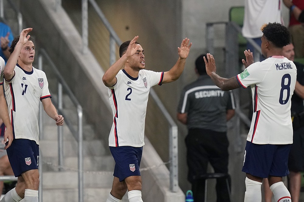 United States' Sergiño Dest (2) celebrates with Weston McKennie (8) after the team scored against Jamaica during a FIFA World Cup qualifying soccer match, Thursday, Oct. 7, 2021, in Austin, Texas. (AP Photo/Eric Gay)