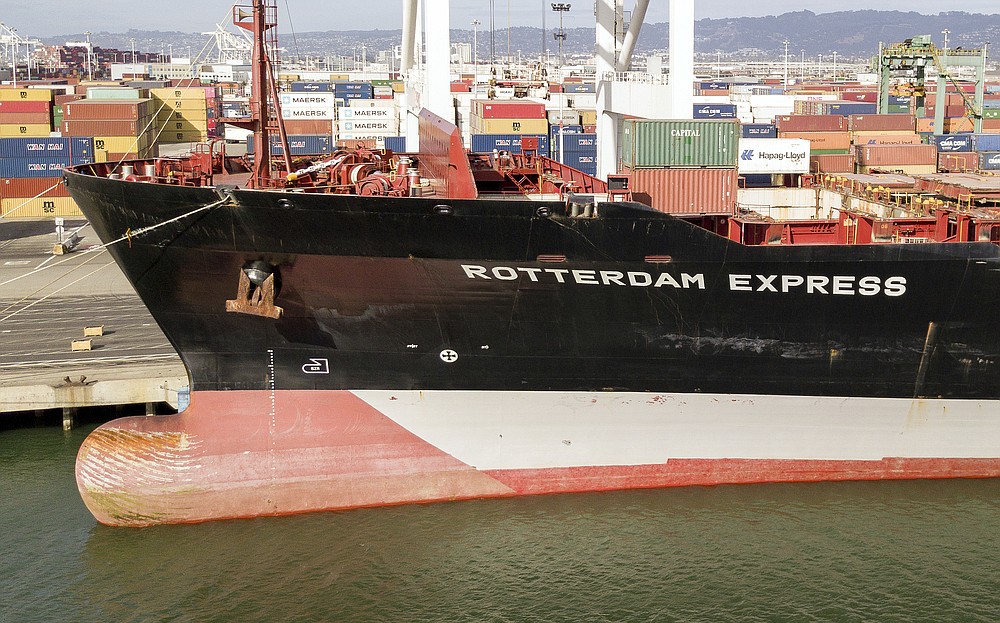 The Rotterdam Express is seen at the Port of Oakland, Wednesday, Oct. 6, 2021 in Oakland, Calif. The Rotterdam Express, a massive cargo ship made a series of unusual movements while anchored in the closest spot to a Southern California oil pipeline that ruptured and sent crude washing up on beaches, according to data collected by a marine navigation service. (AP Photo/Josh Edelson)