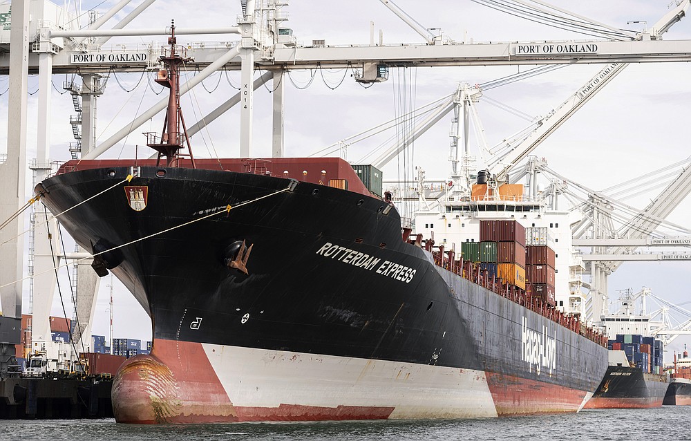 The Rotterdam Express is seen at the Port of Oakland, Wednesday, Oct. 6, 2021 in Oakland, Calif. The Rotterdam Express, a massive cargo ship made a series of unusual movements while anchored in the closest spot to a Southern California oil pipeline that ruptured and sent crude washing up on beaches, according to data collected by a marine navigation service. (AP Photo/Josh Edelson)